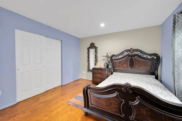 Bedroom with sleigh bed and closet