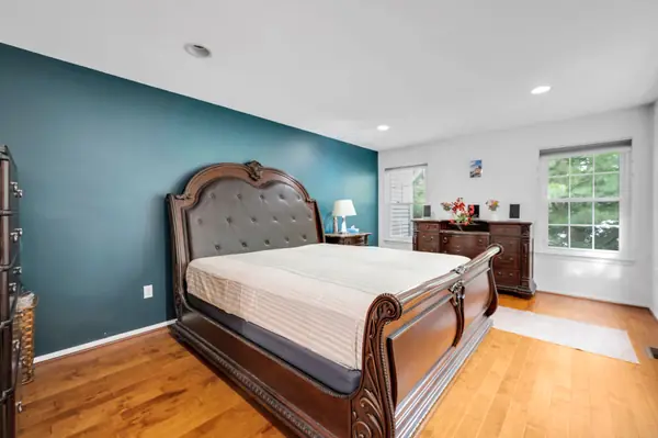 Primary bedroom suite with sleigh bed
