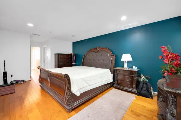 Primary suite showing dark teal accent wall