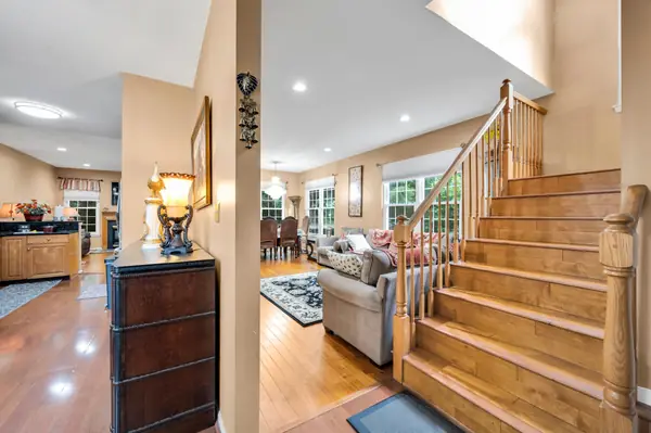 Entry foyer with wooden staircase